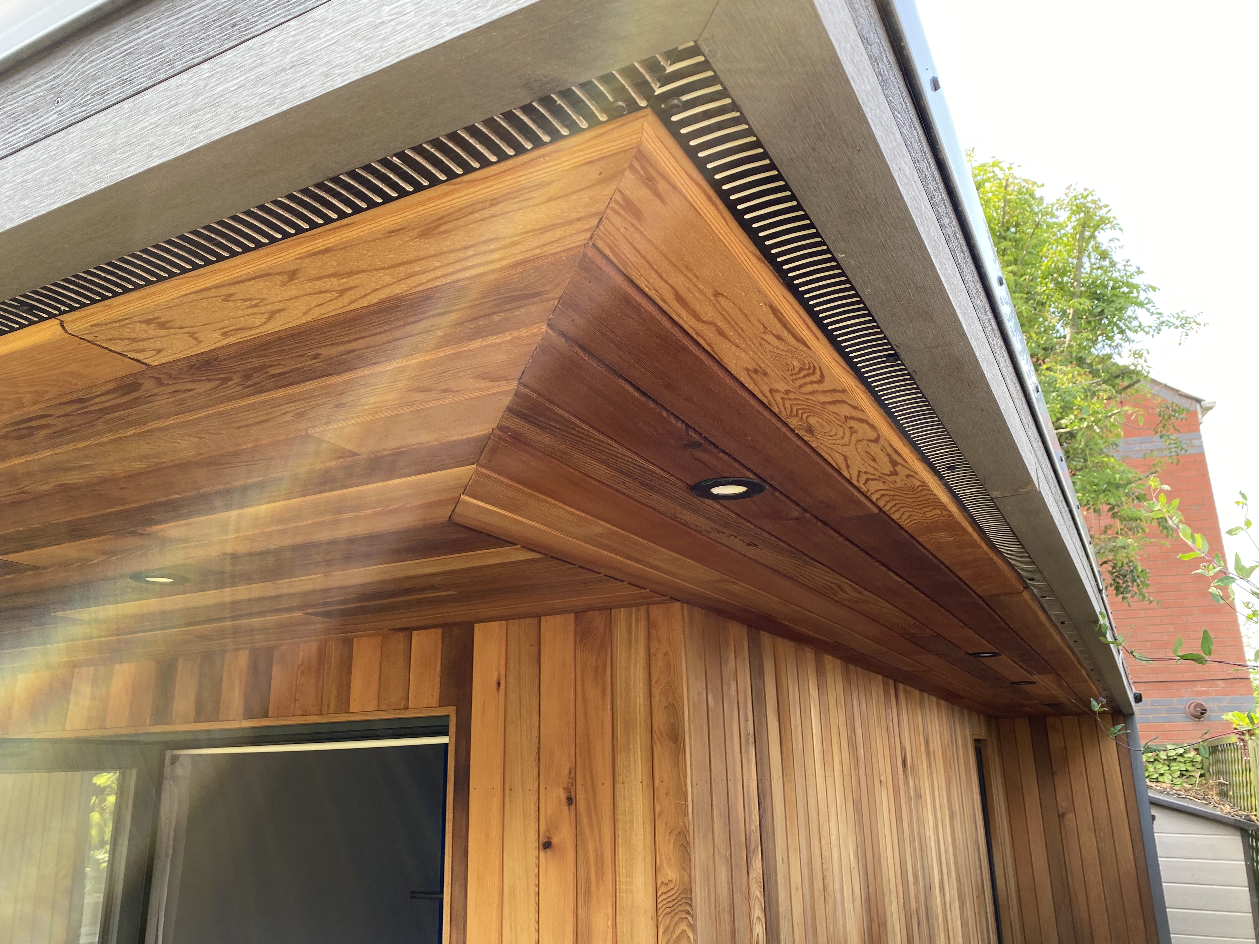 western red cedar cladding on a canopy overhang garden studio in highg barnet london