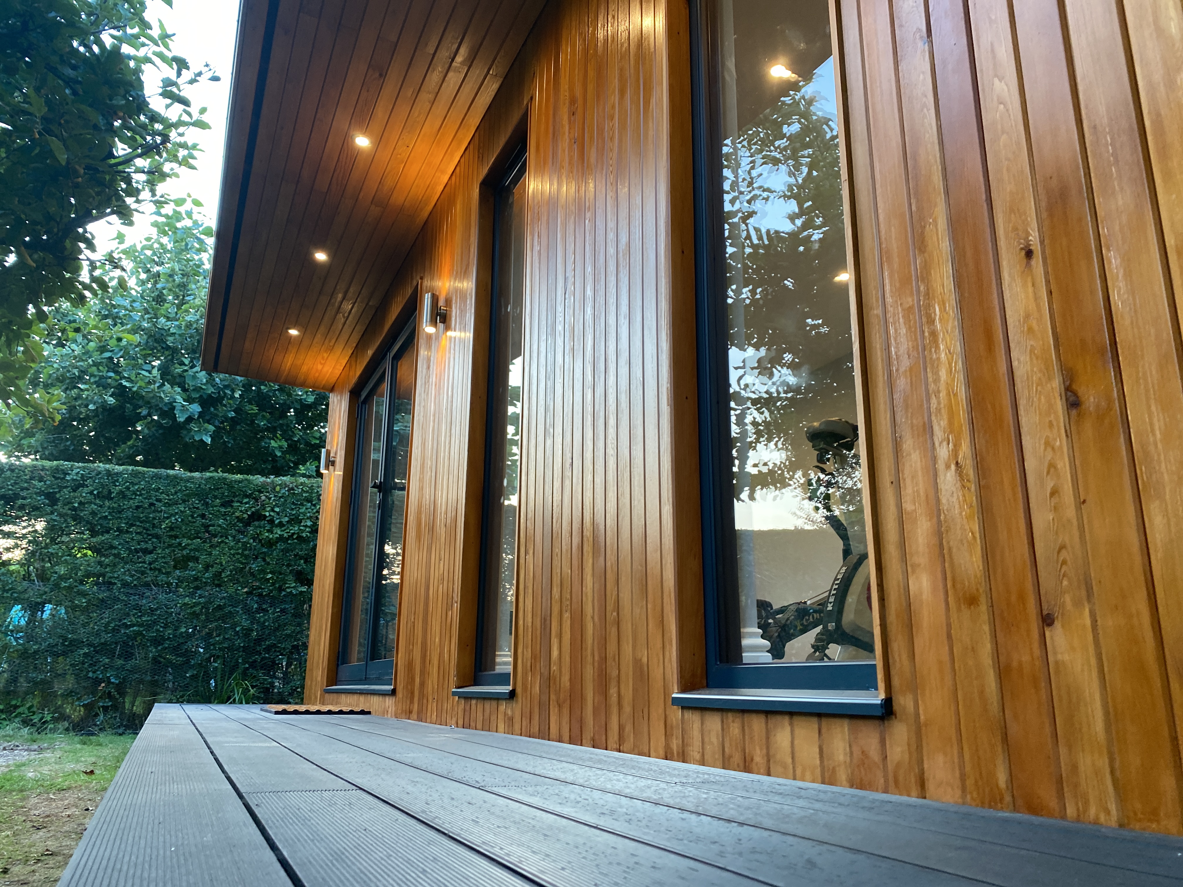 composite decking and siberian larch on garden studio in horley surrey