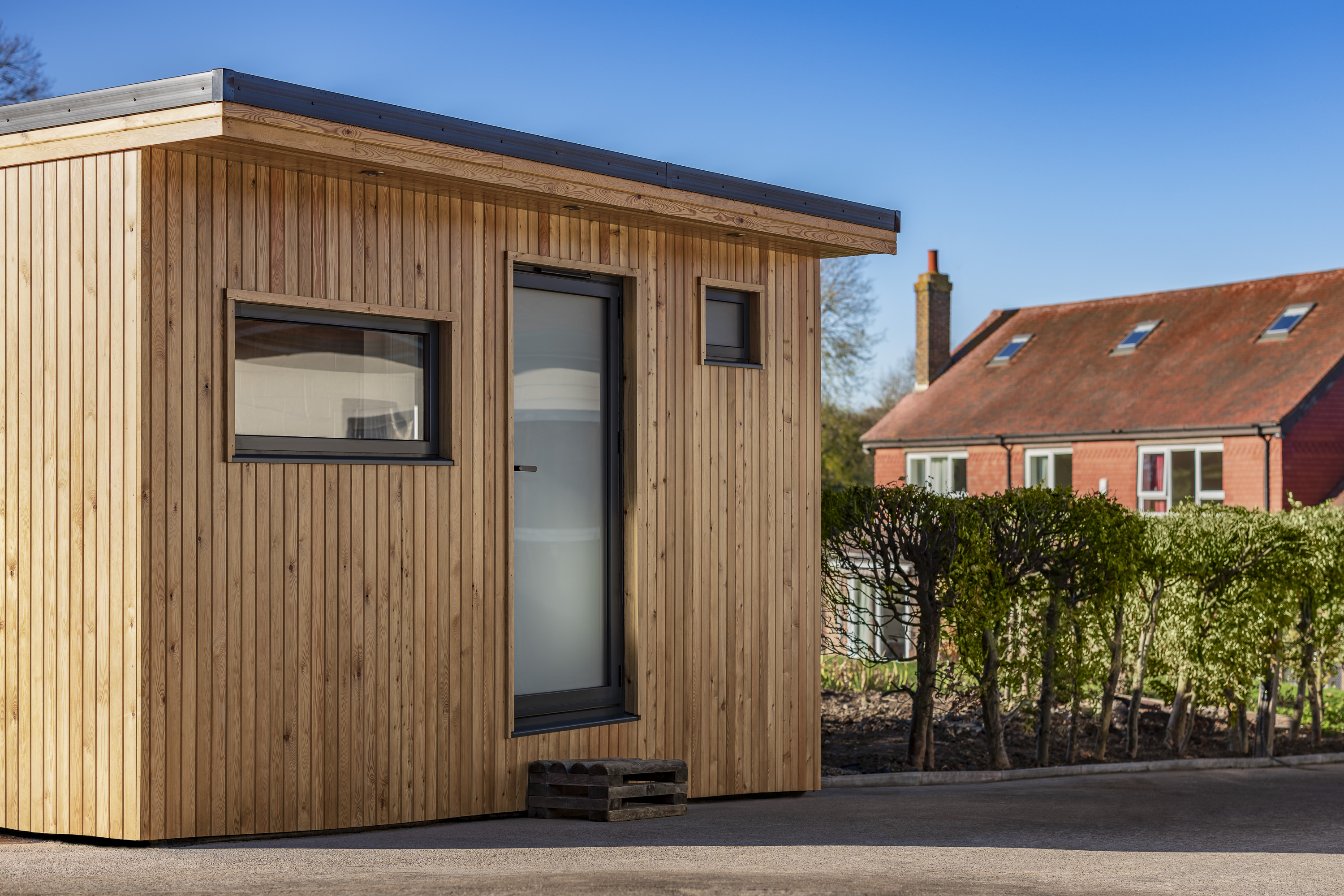 garden room with log store walton on the hill