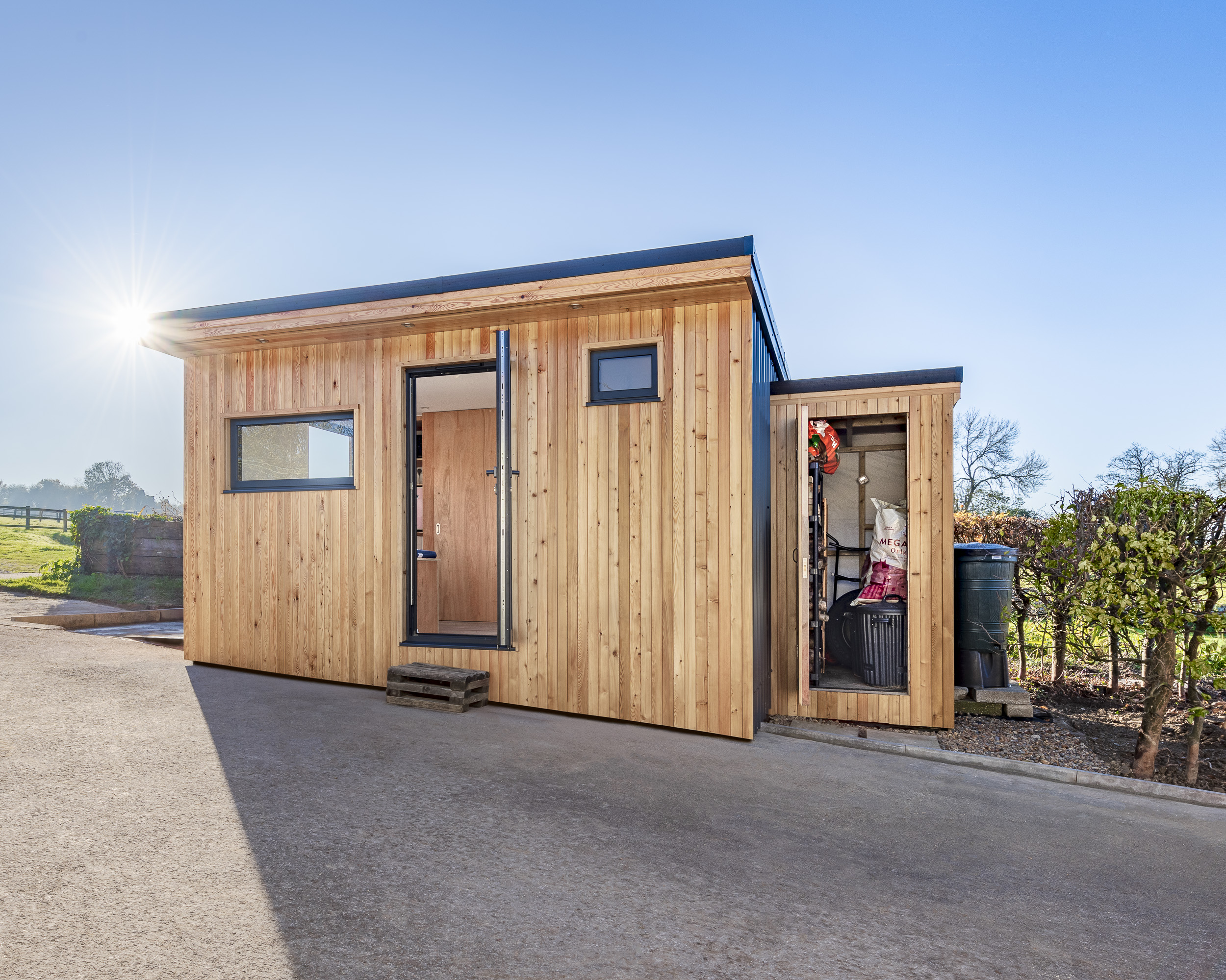 garden room with log store walton on the hill