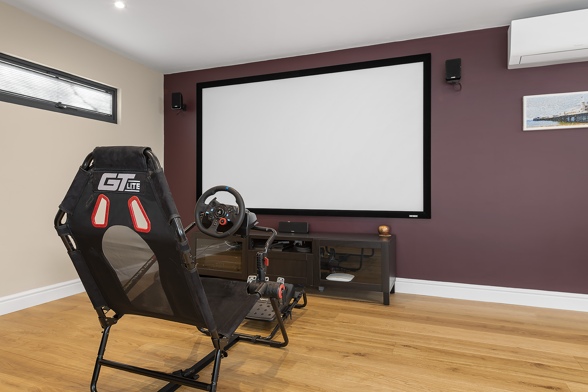 garden room mancave interior shot with projector and hangout area