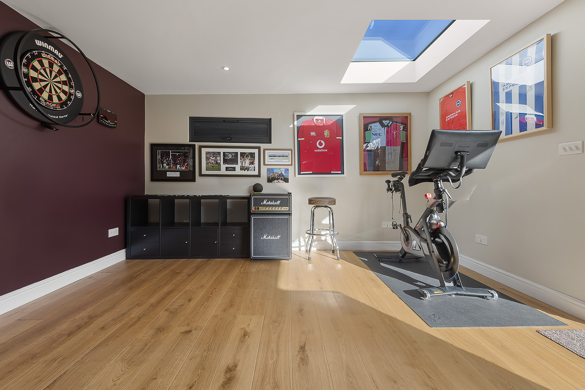 garden room mancave interior shot with peloton bike